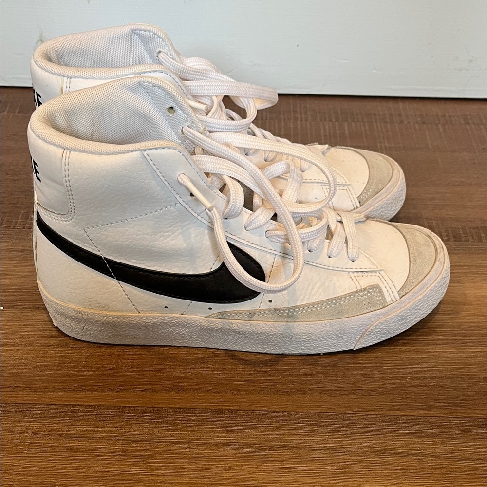 Nike White High-Top Sneakers with Black Swoosh